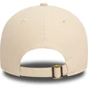 new-era-curved-brim-9twenty-peached-cotton-beige-and-navy-blue-adjustable-cap